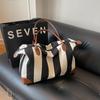 Canvas travel bag, striped fitness, new fashion, large capacity, durable, light shoulder, portable messenger bag, trendy bag.