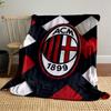 Interwoven red, black, and white strips with an oval emblem in the center. for all seasons blanket lunch break throw gift