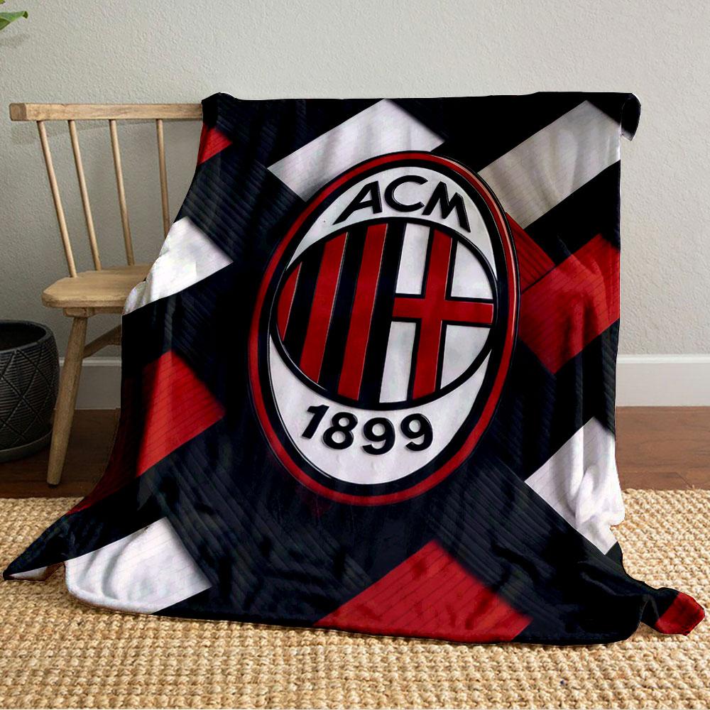 Interwoven red, black, and white strips with an oval emblem in the center. for all seasons blanket lunch break throw gift
