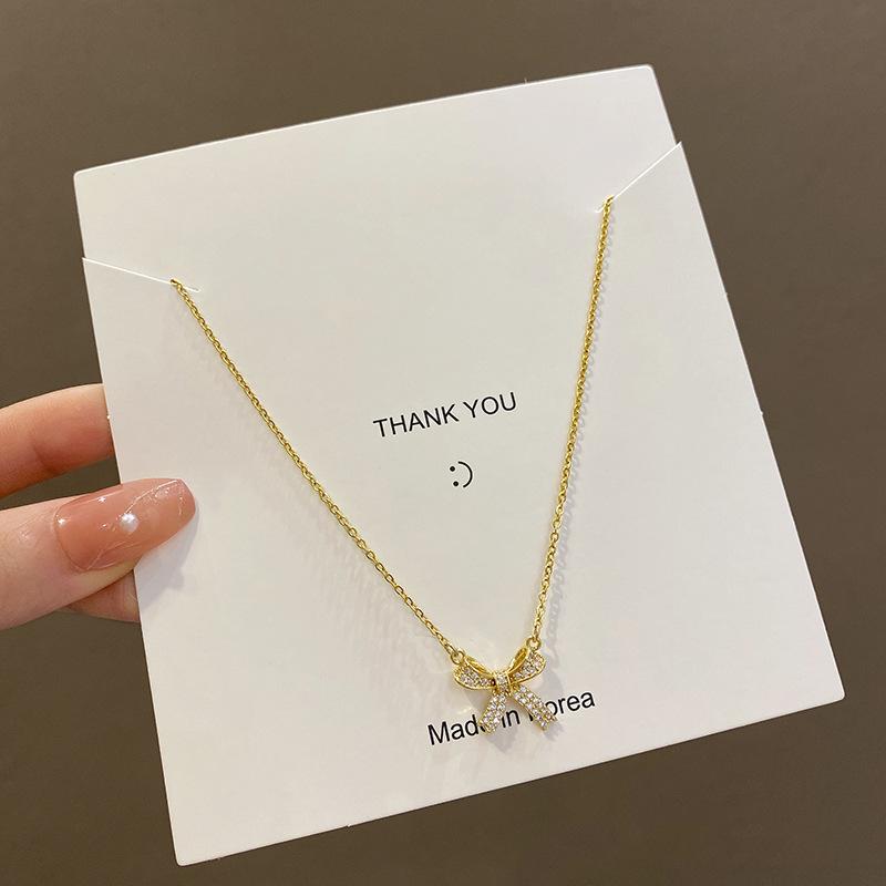 Micro-inlaid zircon bow titanium steel necklace female Spice Girl collarbone chain explosive accessories