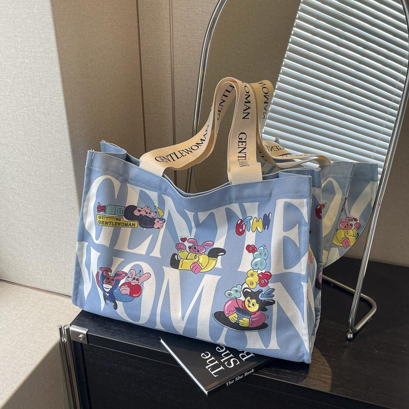 Canvas bag women's large capacity 2025 new bag portable commuter bag casual fashion fresh bag single shoulder mommy bag