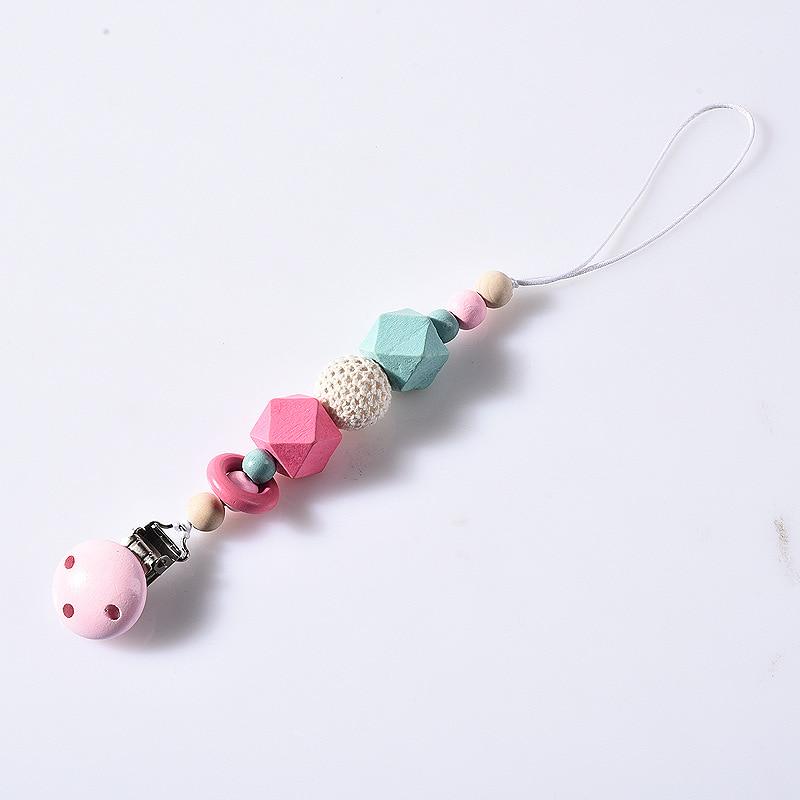 

Дерев яний дитячий затиск для соски. Смішний ланцюжок для соски для годування дитини. Іграшка для прорізування зубів. рожевий