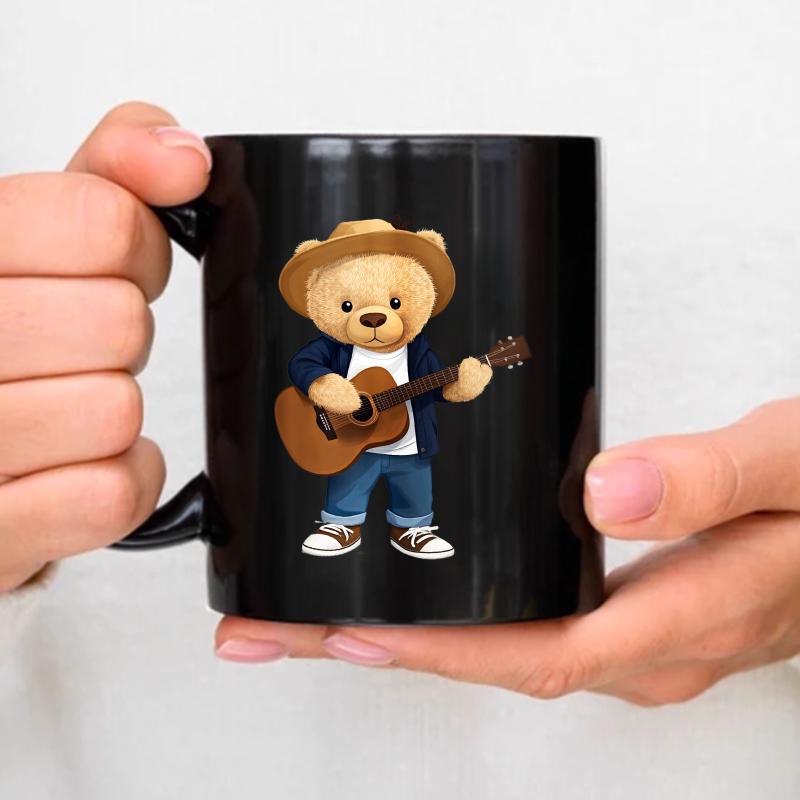 The teddy bear coffee cup, a black cartoon bear playing guitar design, is suitable for home, office and as a gift. чёрный
