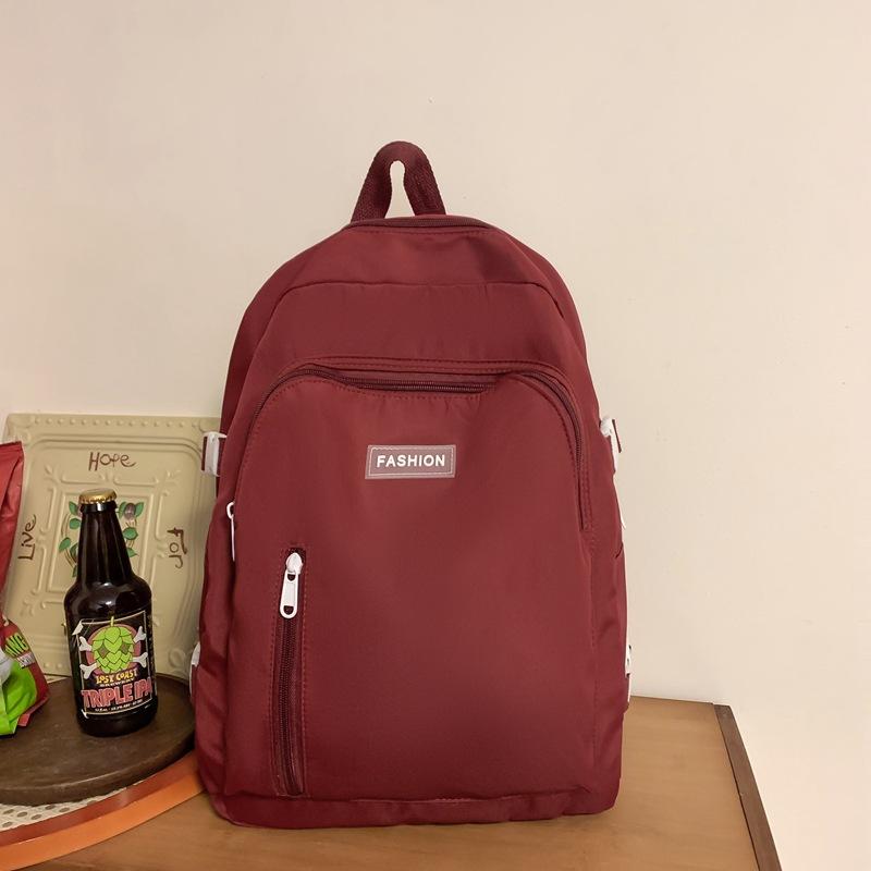 

Новый модный рюкзак большой вместимости, повседневный простой рюкзак для ученика средней школы красный