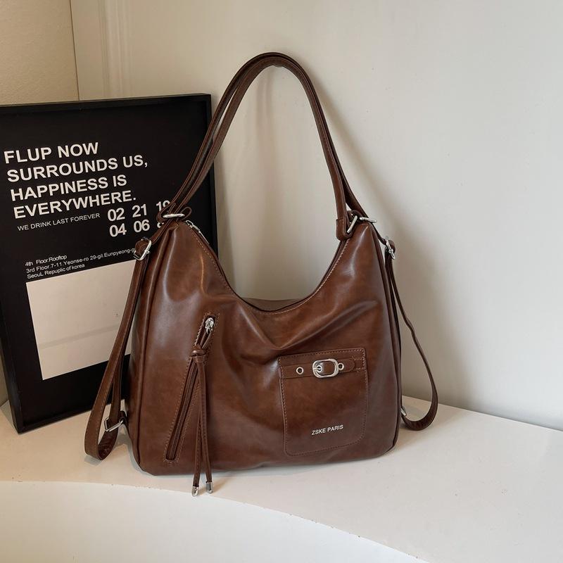 

Вместительная сумка-тоут женская 2025 осень новая нишевая повседневная в иностранном стиле сумка подмышку сумка-рюкзак на плечо для поездок на работу