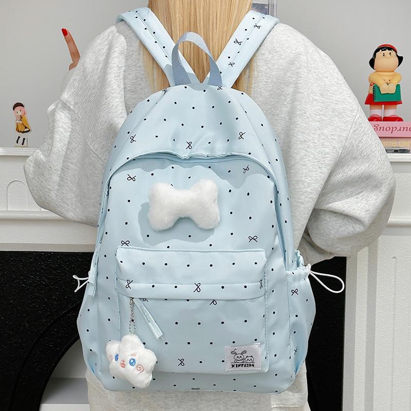 Polka Dot Bow Backpack for Teen Girls: Stylish and Versatile Schoolbag for Middle and High School Students.