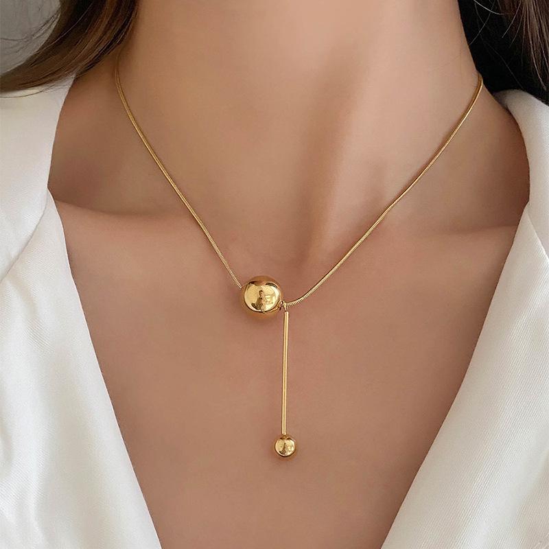 Golden Orb Titanium Steel Necklace: Light Luxury, Fade-Resistant, Niche Clavicle Chain with Pendant for Women