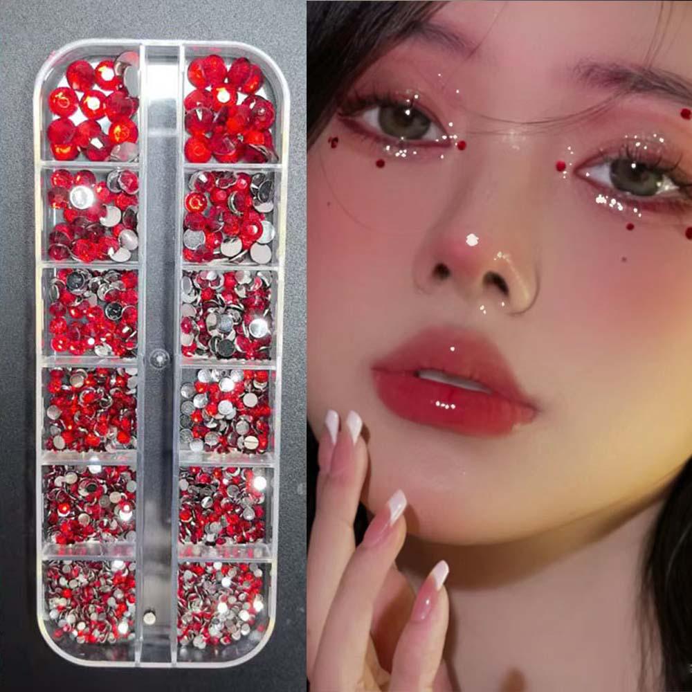 

Новогодний красный маникюр с неровными стразами и наклейками для лица в виде капель Items