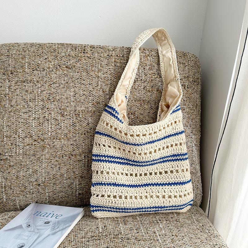 

Casual shoulder bag women s autumn and winter new fashion bucket bag hollow large capacity underarm bag woven bag синій