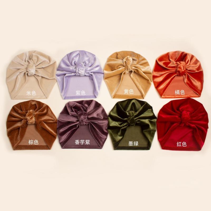 

Autumn baby solid color golden velvet knotted hat, children s soft and delicate pullover hat, baby hat