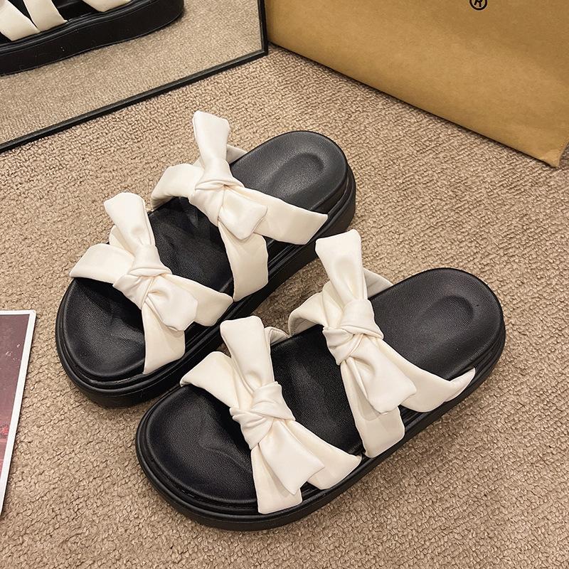 Bow-tie one-word cool slippers women's 2025 summer new Korean version of cute students thick-soled open-toed women's slippers