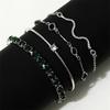 European & American Fashion Green Snake Diamond Bangle Set: Women's 4-Piece High-End Metal Jewelry with Elastic Design.