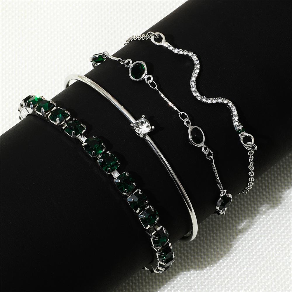 European & American Fashion Green Snake Diamond Bangle Set: Women's 4-Piece High-End Metal Jewelry with Elastic Design.