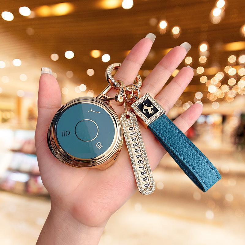 Applicable to Nezha V car Nezha U Pro key set bag, high-end protection, anti-drop personalized buckle, men's and women's new energy shell