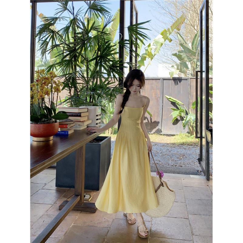 Small yellow suspender dress women's summer new waist temperament long dress seaside vacation skirt