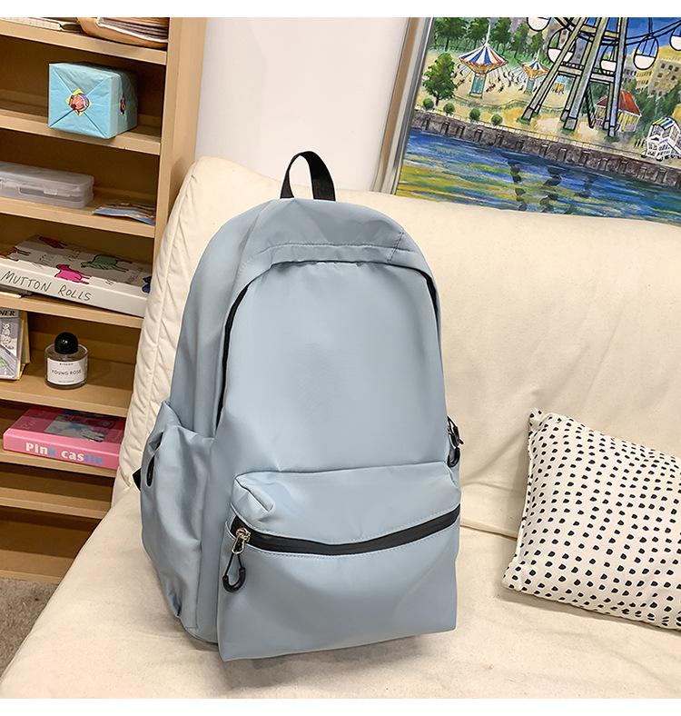 School bag solid color letter fashion backpack Korean version college student lightweight school bag outdoor travel large capacity backpack
