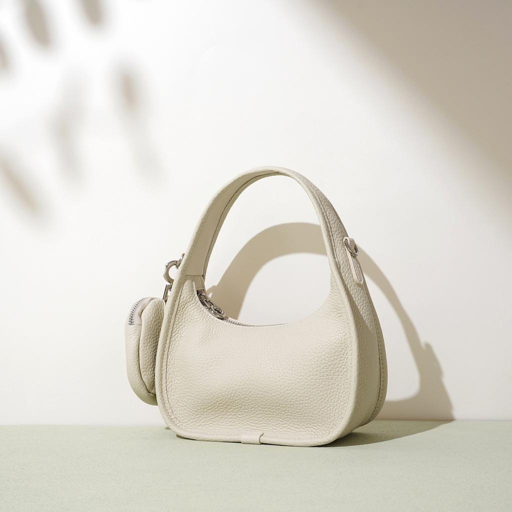 Neue kleine Tasche, Premium-Handtasche, Ein Schulter, Unterarm-Crossbody-Halbmondtasche, Kopfhörertasche.