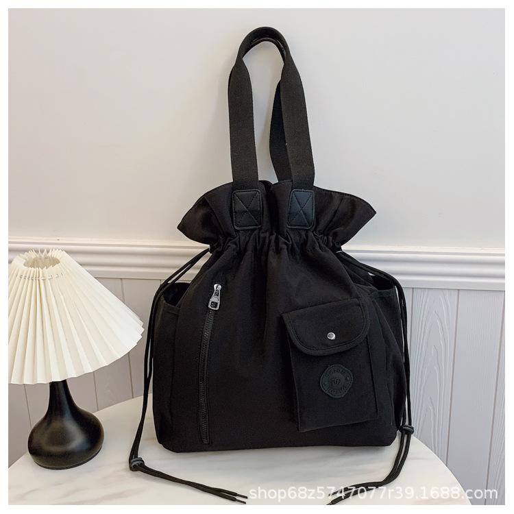 

Lightweight women s bag 2025 new women s large-capacity versatile portable shoulder bag fashion bundle bag canvas messenger bag чёрный