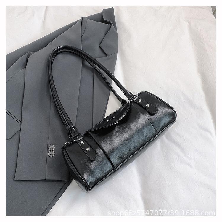 Retro high-end hand-held bowling bag women's 2025 new simple and fashionable shoulder bag versatile commuter messenger bag