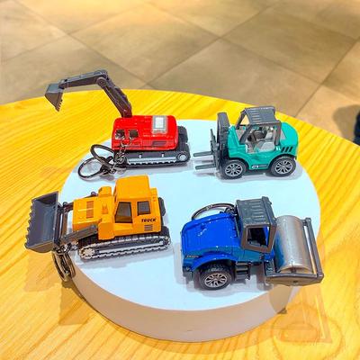 Kreativer Cartoon Mini Bagger Schlüsselanhänger Spielzeug - Perfekt für Rucksäcke oder als Autoanhänger.