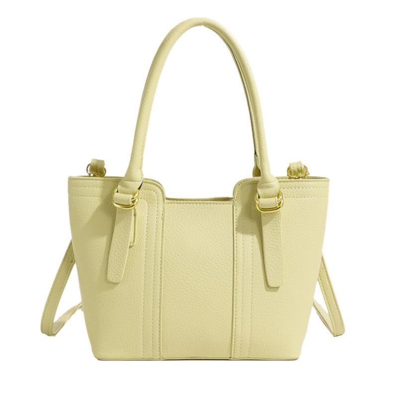 

В этом году популярные маленькие сумки 2025 новые женские сумки, высококлассные универсальные сумки-мессенджеры для通勤, модные портативные сумки-ведра жёлтый