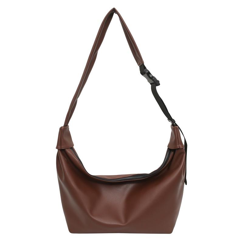 Simple, fashionable and large-capacity pu men's and women's locomotive commuter bags, new literary and versatile women's shoulder messenger bags