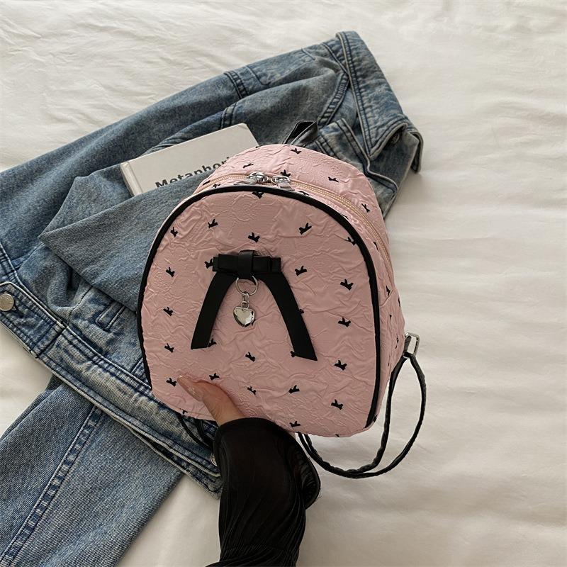 

Women s bag new fashion trend bow niche design bag versatile simple texture backpack розовый