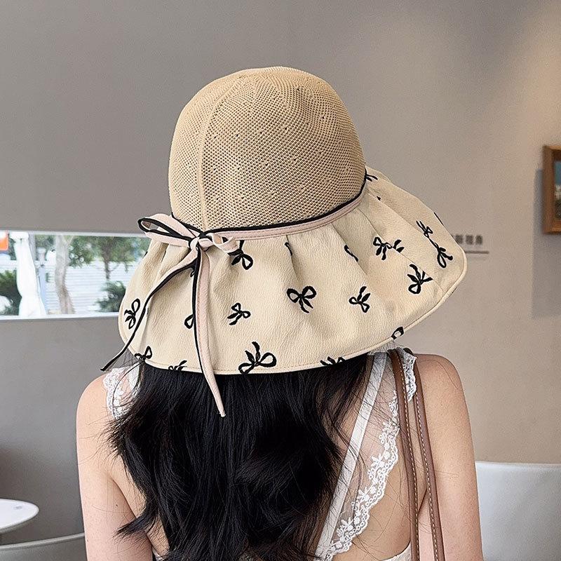 Hat women's spring and summer new bow knitted empty top hat vinyl sunscreen beach sunshade printing folding sun hat