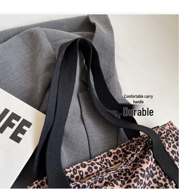 Leopard Print Canvas Tote: Large Capacity Autumn Shoulder Bag for Women, Versatile for College and Commute.