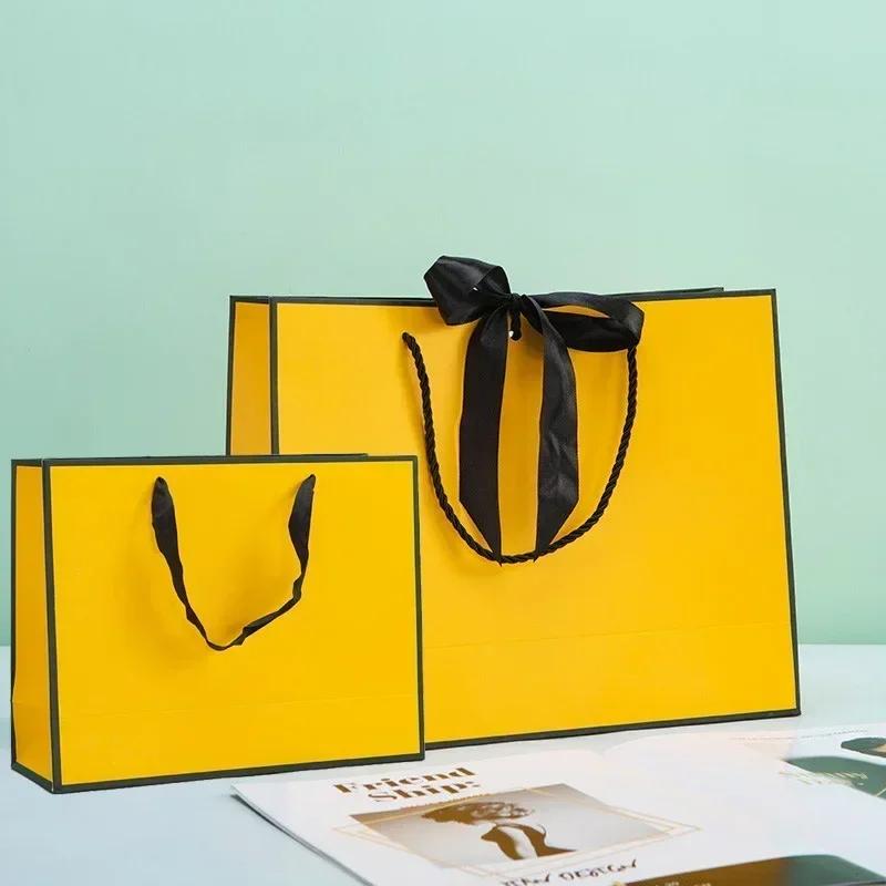 White Paper Jam Handbag Kraft Paper Thick Waterproof Frame Rivet Handle Gift Bag Cosmetic Clothing Store Portable Packaging Bags