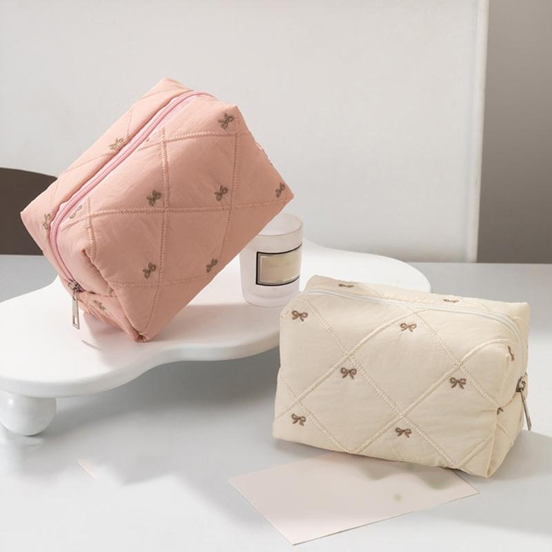 Large Capacity Makeup Organizers with Quilted Bowknot Accent and Multiple Divisions for Efficient Travel