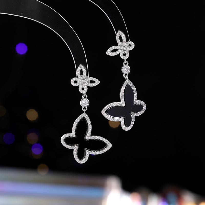 

Light luxury super fairy white fritillary butterfly earrings women s fashion high sense temperament niche design sense silver needle earrings