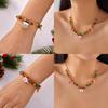 Weihnachtsaccessoires Halskette und Armband Kollektion mit bunten Glöckchen, Schneemann und Weihnachtsmann für saisonales Tragen