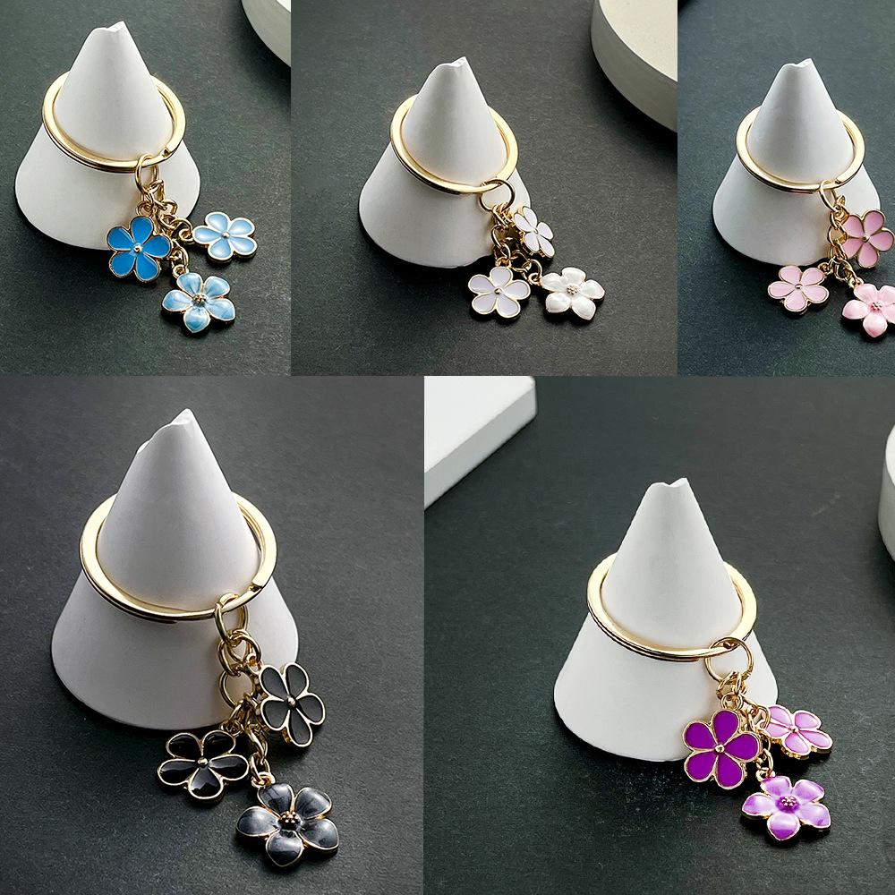 Sakura Oil Drop Keychain – Available in Black, White, Blue, Pink, Purple | Multiple Colors and Metal Parts | Luggage Accessory