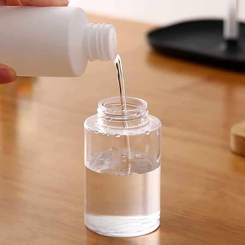 Makeup Remover Dual-Layer Travel Bottle: Portable, Hydrating, Press-Squeeze Design