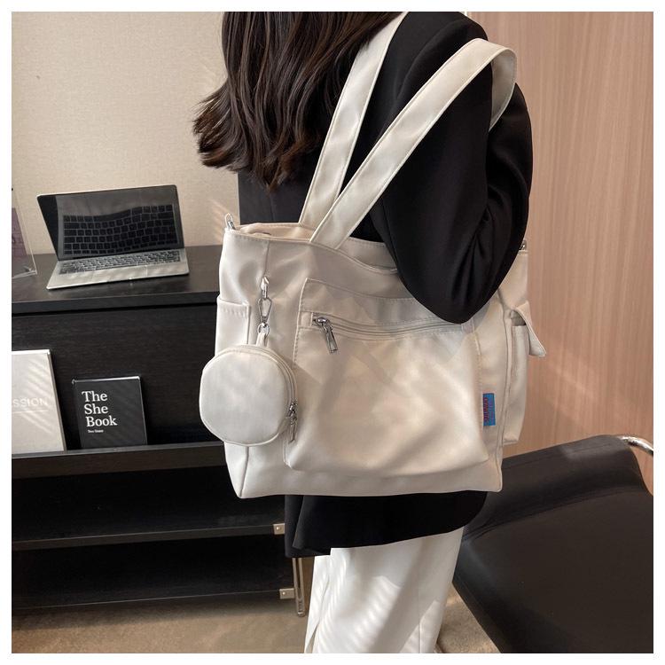 Japanese-Style Canvas Crossbody Bag: Double Pocket, Large Capacity, Women's Tote, Solid Color, Perfect for Students and Commuting.