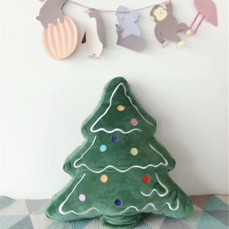 Christmas Holiday Decoration: Tree Plush, Apple Peace Wreath, and Gingerbread Man Throw Pillow.