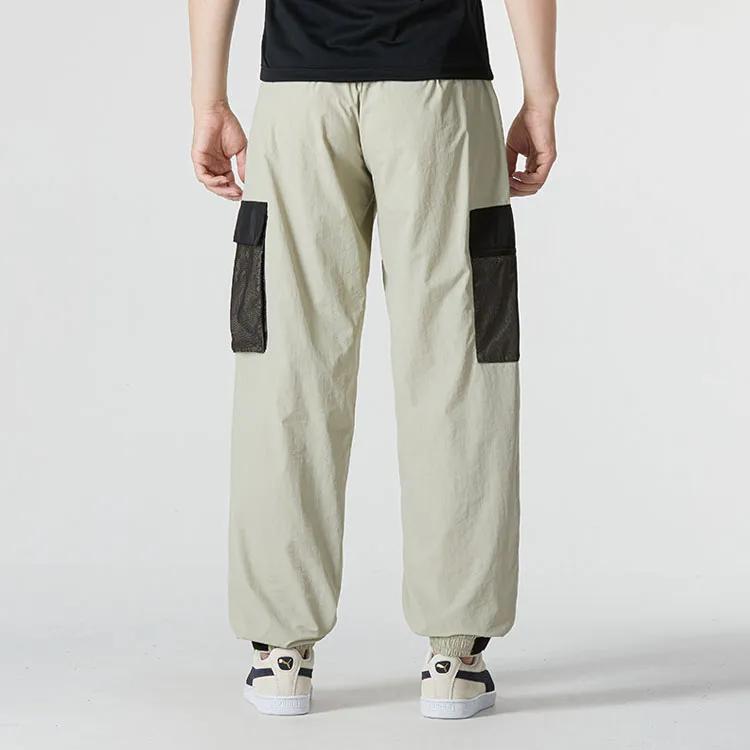 PUMA Sports Pants Men's Light Gray Moderate (Unisex) Sports Pants 537530 68