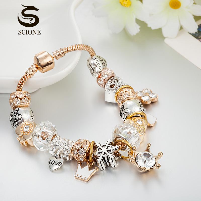 SCIONE Náramek s krystalovými korálky, korunou a láskou, sněhovou vločkou a přívěskem