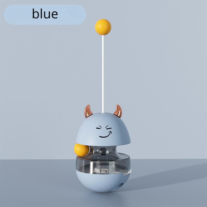 Ein süßer Becher, der Katzenfutter fallen lässt, um mit Katzen zu spielen