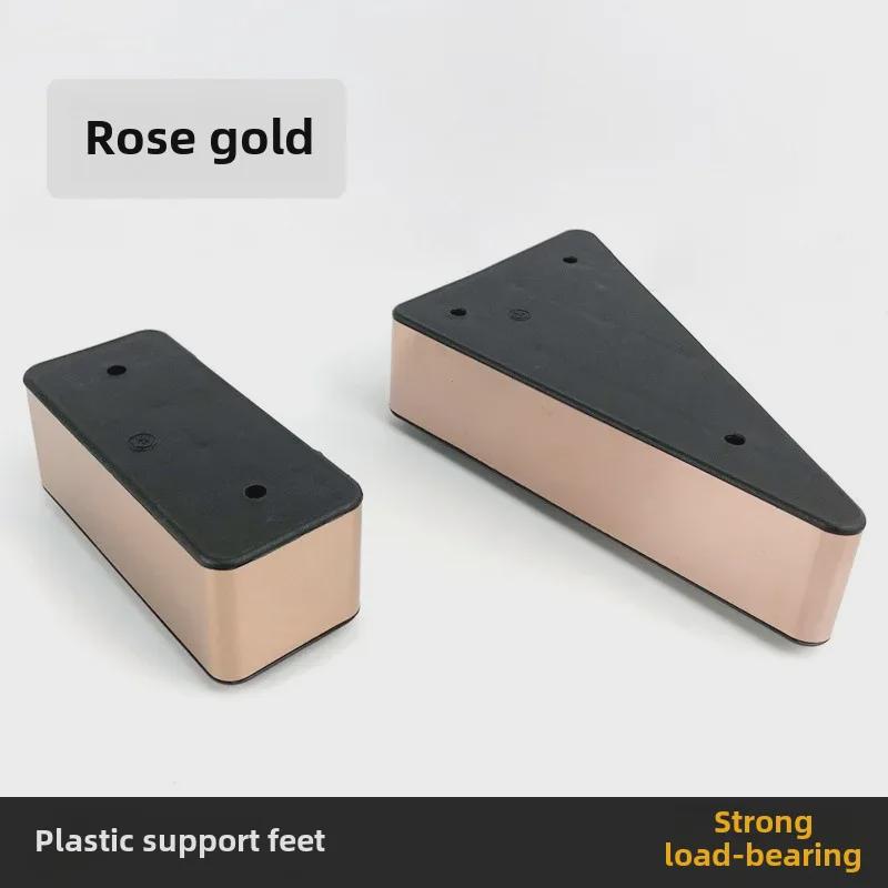 Podložky pod nohy pohovky ve tvaru trojúhelníku v barvě růžového zlata - Nerezová ocel a plast, Zvyšující výšku, Design s pravým úhlem.