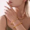 Qiong Yao Heart-Shaped Bangle: Titanium Steel with 18K Gold Plating, Niche Design, Elegant Texture.