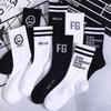 Zhuji Men's Trendy Black & White Mid-Tube Basketball Socks - Sweat-Absorbent, Breathable, Autumn/Winter.