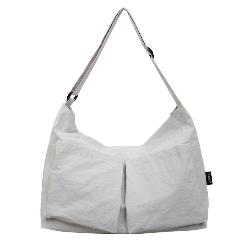Borsa a tracolla minimalista in tela con chiusura a zip per uso quotidiano casual