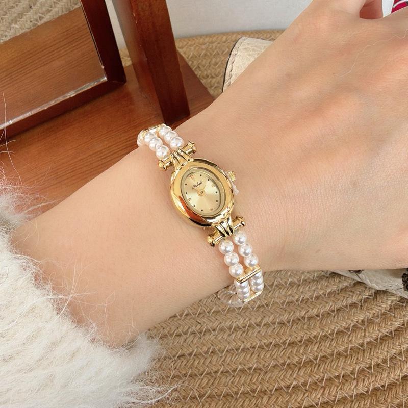 Neue Vintage kleine Goldene Uhr Luxuriös und Exquisit Runden Zifferblatt Premium Perlenarmband, Mode Damen Quarz Uhr
