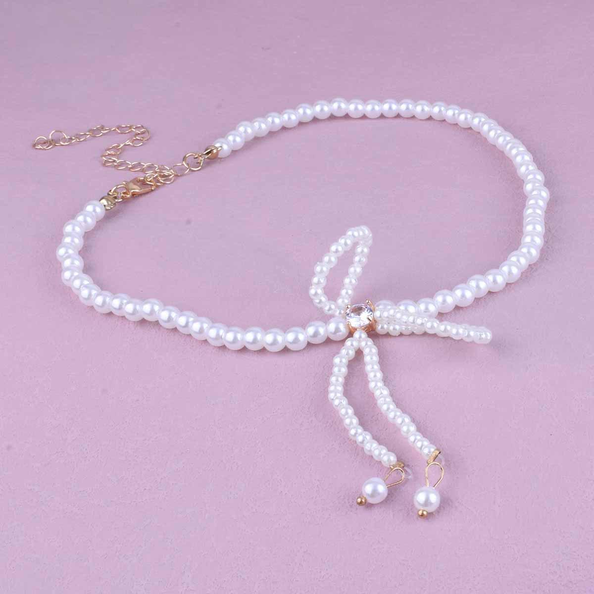 Elegant Pearl Tassel Necklace with Rhinestone Bow