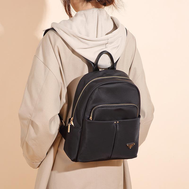 Nowy Plecak Damski Wysokiej Klasy Zmysł Mody Casual Podróż Lekki Tkanina Oxford Prosty Do Pracy Dojazdowy Niszowy Plecak