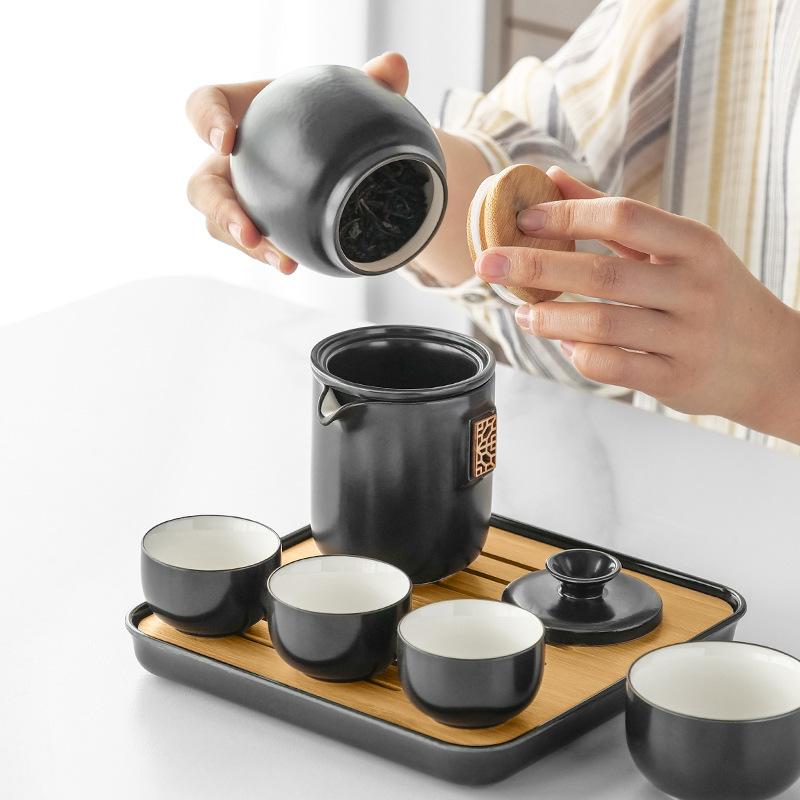 Portable four-load ceramic travel kung fu tea set, one pot and four cups of ceramic simple gift box, gift set