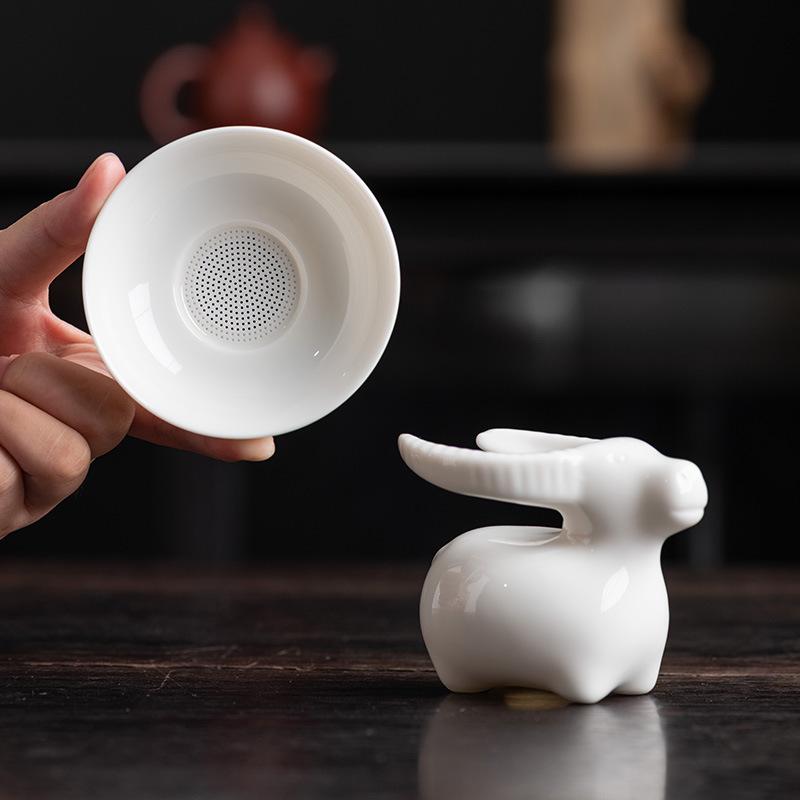 Talgjade Teeleck Weißporzellan Haushalts-Teeset Zubehör Teezeremonie Ochsengas Gold alle hundert Löcher Porzellan Teefilter