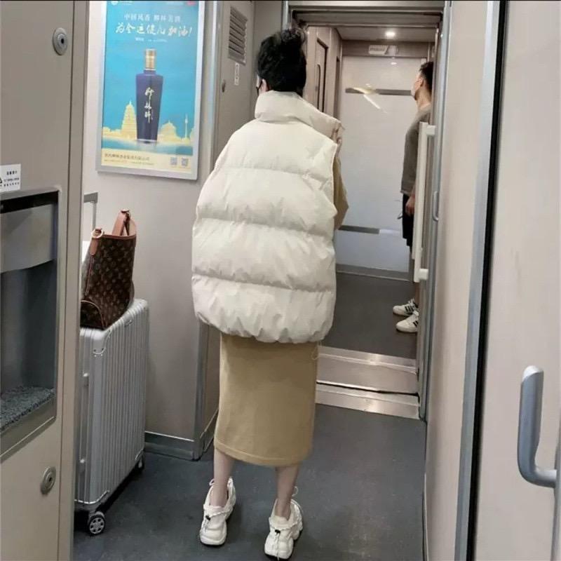 Dámská vesta z prachového peří